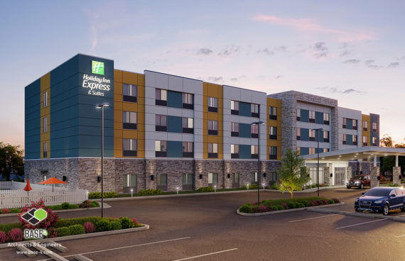 Dusk view of Holiday Inn Express & Suites with stone facade and welcoming entrance, designed by BASE4.