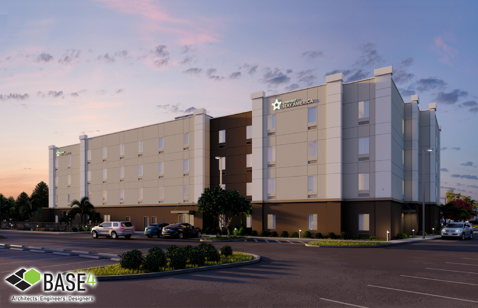 Twilight view of Extended Stay America hotel showcasing modern design and ample parking, highlighting the hotel's accessibility and appealing architecture.