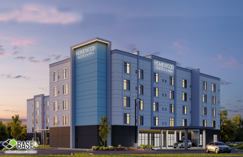 Twilight view of HOMEWOOD SUITES by Hilton, designed by BASE4, featuring modern architecture with warm lighting and inviting landscaping, emphasizing comfort and style in extended-stay accommodations.