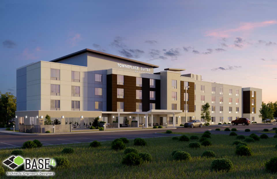 Twilight view of TownePlace Suites, showcasing modern architectural design by BASE4 Architects Engineers Designers, featuring a stylish blend of wood and concrete elements.