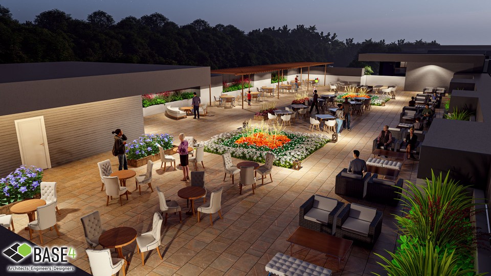 A modern rooftop amenity with BBQ station and seating area in a multifamily housing complex.