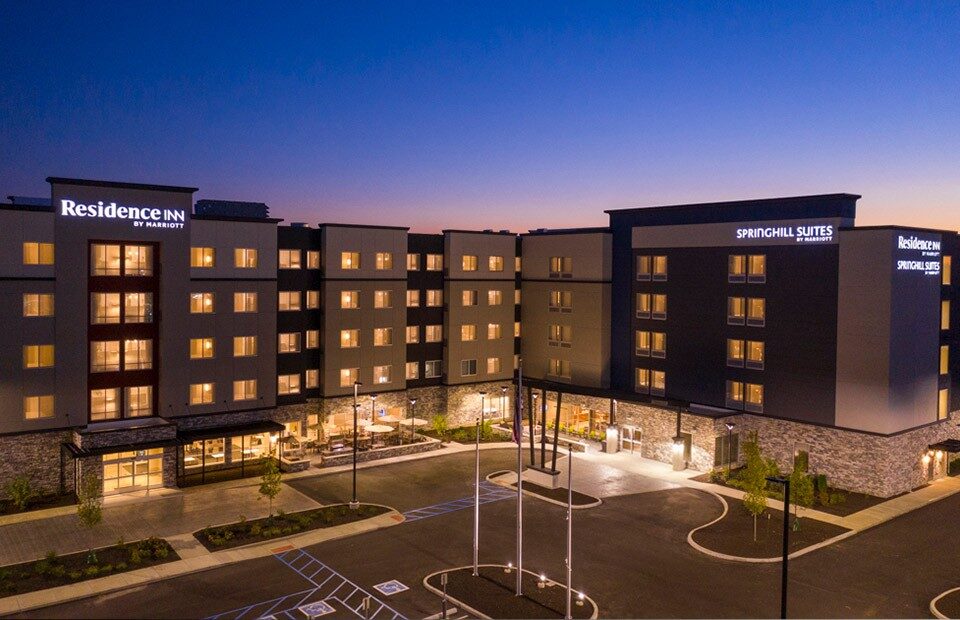 DUAL RESIDENCE INN & SPRINGHILL SUITES hotel showcasing modern design, parking, highlighting the hotel's appealing architecture.