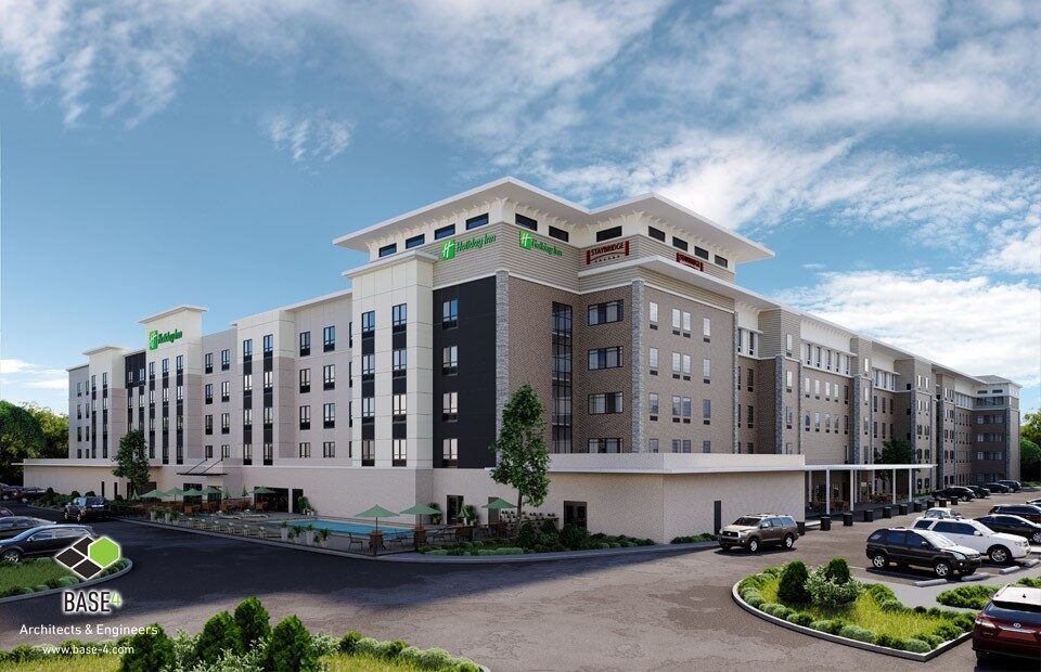 DUAL STAYBRIDGE SUITES & HOLIDAY INN hotel showcasing modern design, parking, highlighting the hotel's appealing architecture.