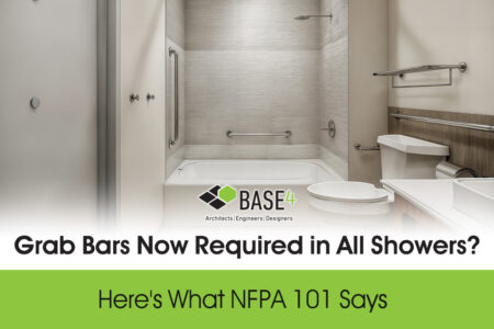 Shower with horizontal and vertical grab bars required under NFPA 101